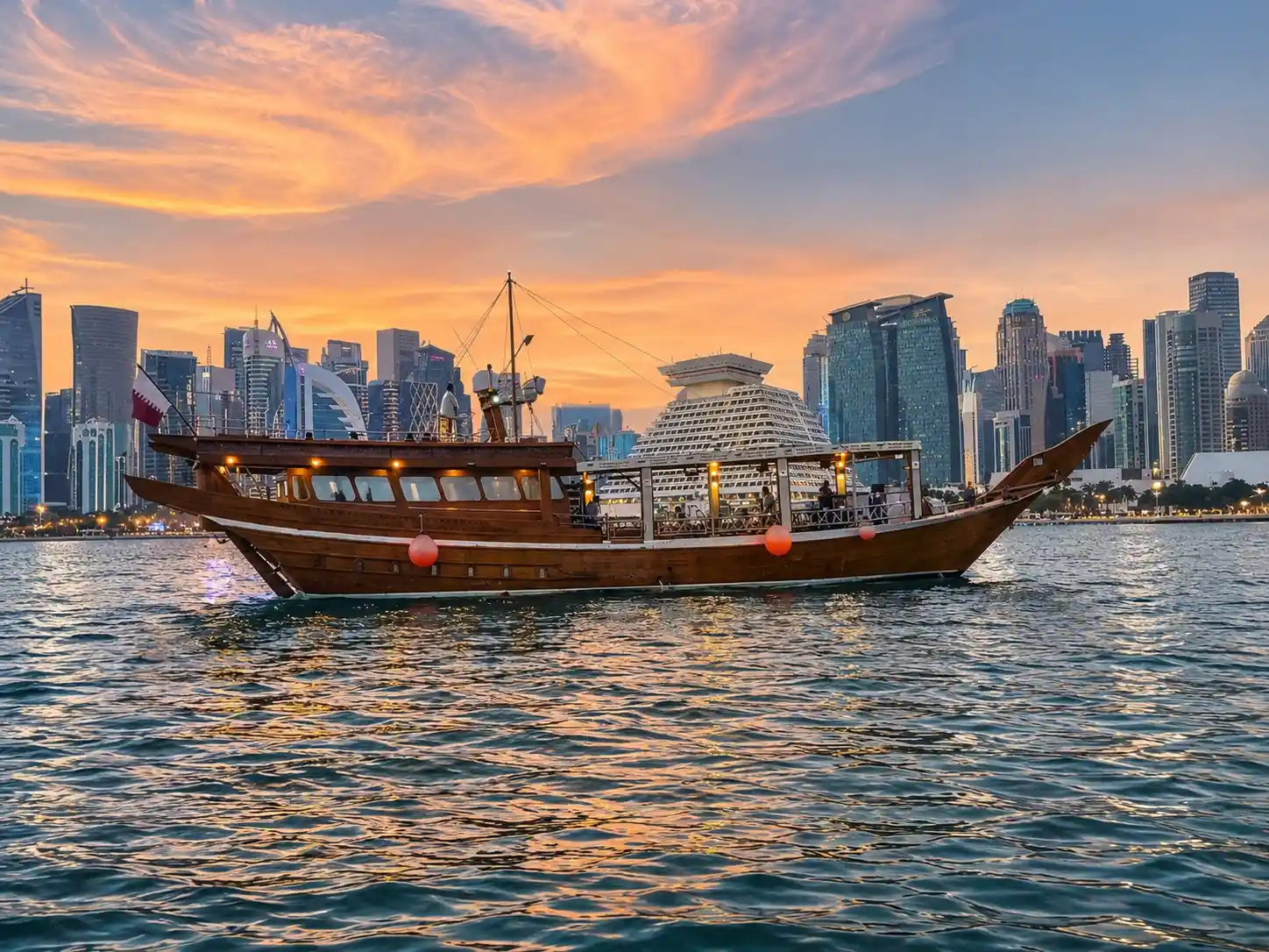 Traditional dhow cruise on Doha Bay at sunset